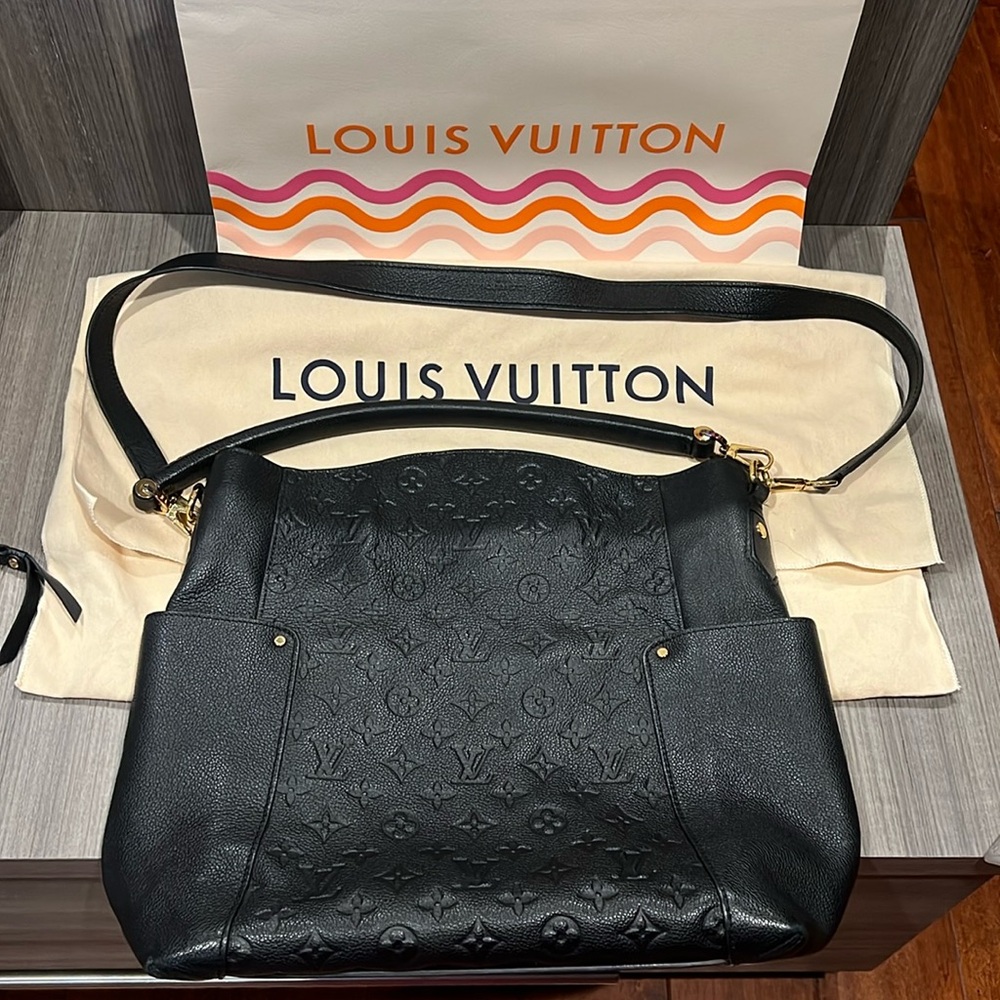 Beautiful black leather LV bag previously loved and cherished.